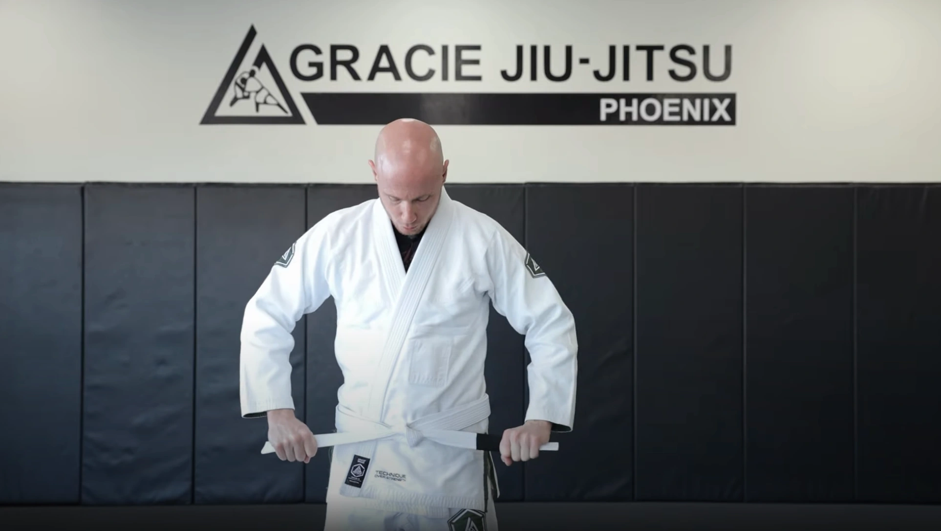 Tightening the BJJ belt knot for a neat appearance